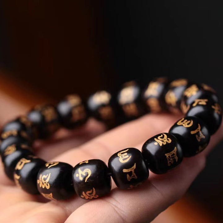 Braccialetto della pace inciso Buddha Stones in legno di ebano tibetano Om Mani Padme Hum
