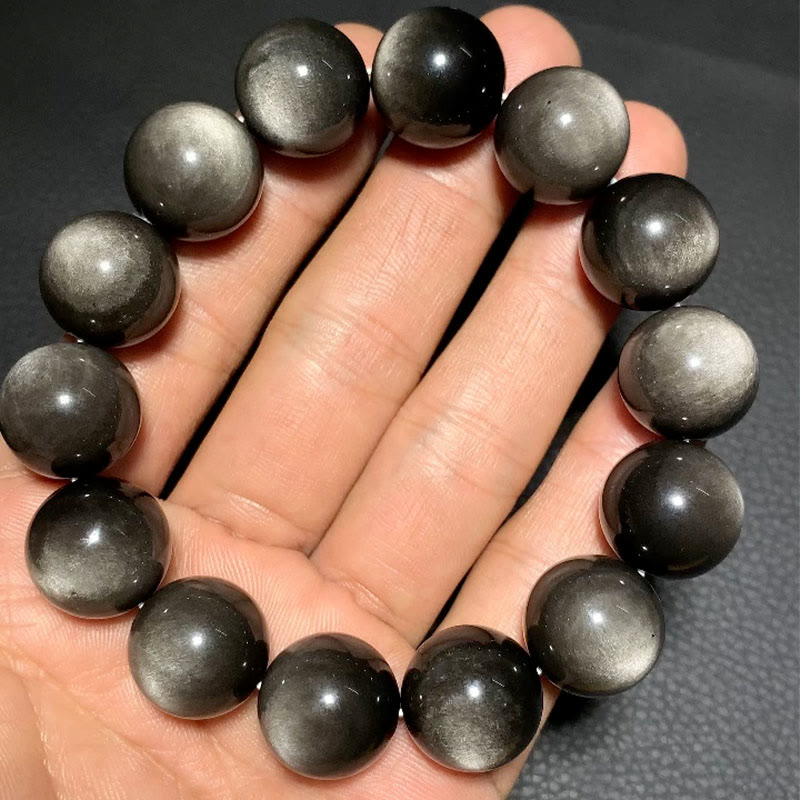 Braccialetto di protezione lenitiva in ossidiana lucida d'argento naturale Buddha Stones