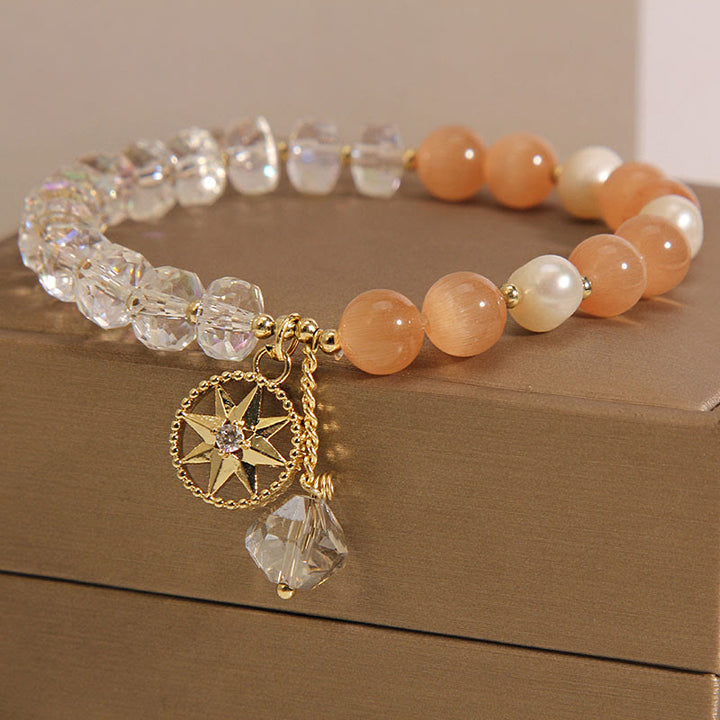 Braccialetto di supporto con stella di cristallo bianco e occhio di gatto arancione Buddha Stones