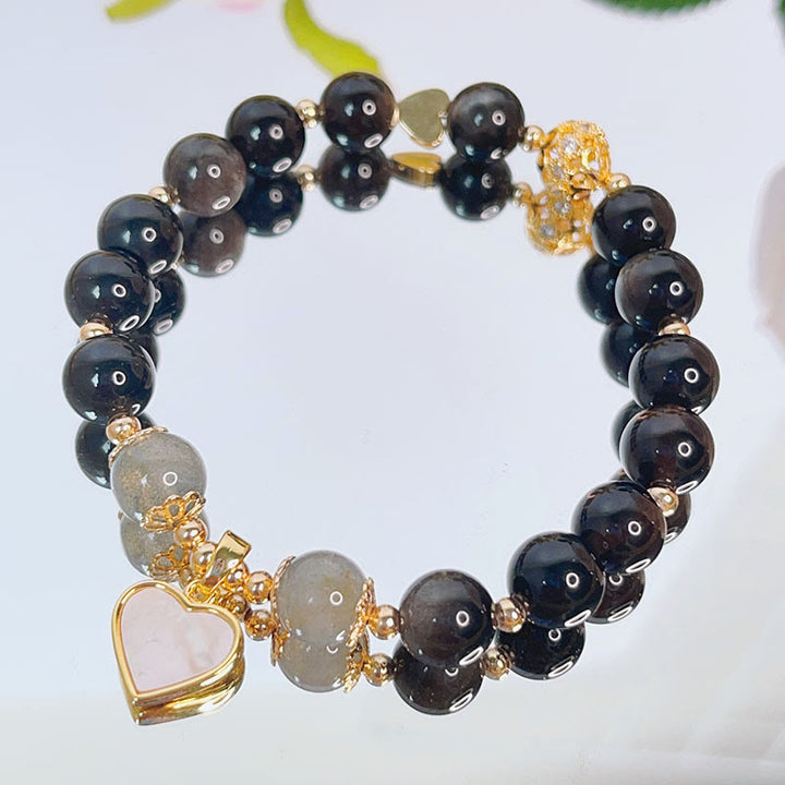 Braccialetto di protezione con cuore, stella e fiore in ossidiana naturale con Buddha Stones argento lucido