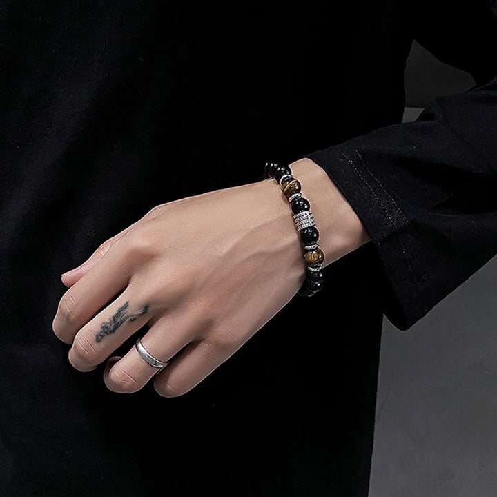 Bracciale Buddha Stones in ossidiana nera naturale con occhio di tigre e forza