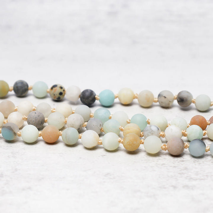Braccialetto Mala con nappa in perle di amazzonite Buddha Stones 108