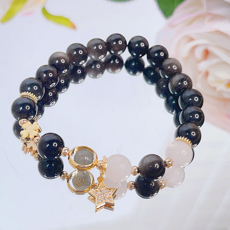 Braccialetto di protezione con cuore, stella e fiore in ossidiana naturale con Buddha Stones argento lucido