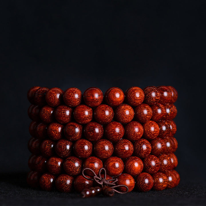 Braccialetto di equilibrio in legno di sandalo rosso con foglia piccola tibetana Buddha Stones