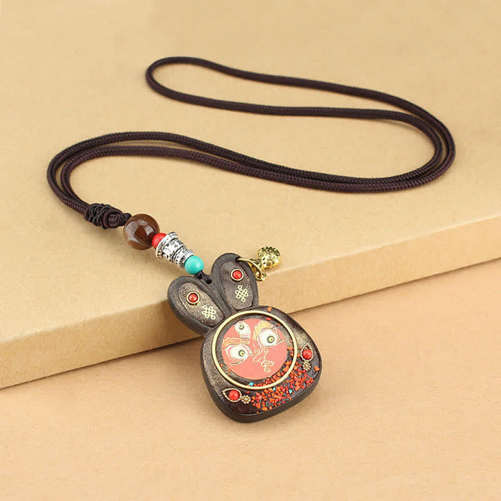 Collana pendente Thangka con cinque divinità della ricchezza in ebano tibetano
