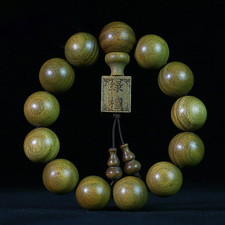 Braccialetto di cura in legno di sandalo verde tibetano Buddha Stones