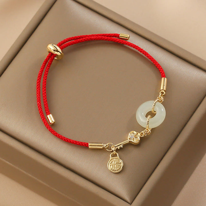 Braccialetto in corda rossa con fibbia della pace in giada Hetian placcato oro 18K con carattere Fu e Buddha Stones