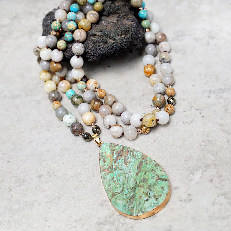 Collana di perline di guarigione in diaspro Picasso naturale dell'oceano Buddha Stones