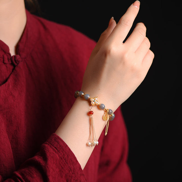 Braccialetto di equilibrio con nappa di perle di carattere Fu in agata grigia naturale Buddha Stones