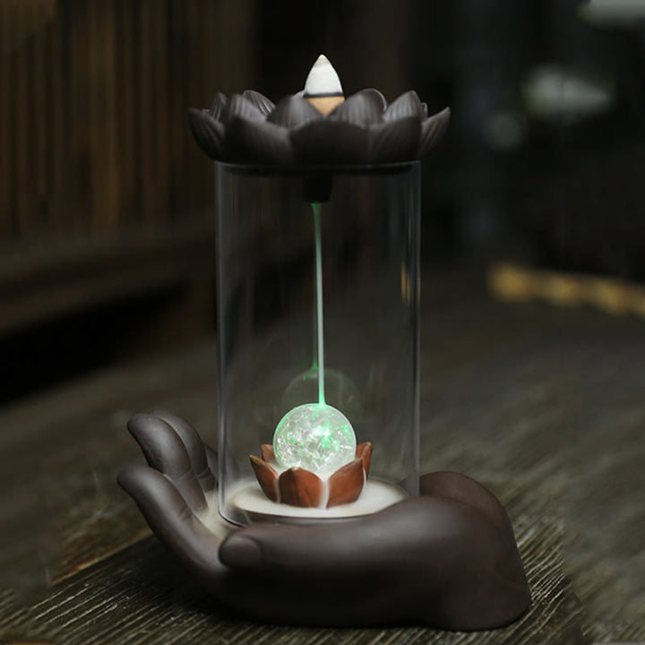 Buddha Stones Mano di Buddha Loto Illuminazione LED Luce Viola Argilla Ceramica Bruciatore di Incenso Decorazione