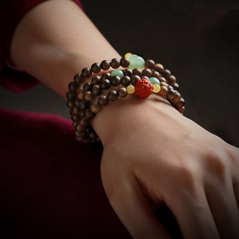 Buddha Stones 108 perle di Mala Kalimantan Agarwood Zucca Giada Ambra Bracciale equilibrio