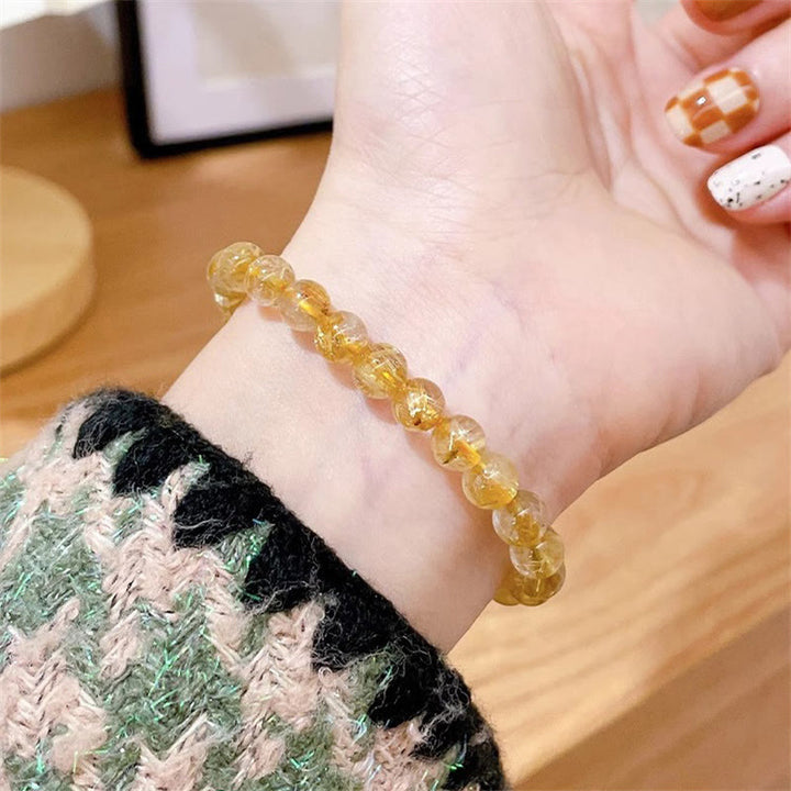 Bracciale Buddha Stones in oro naturale, quarzo rutilato, pietra del sole, cianite, ricchezza