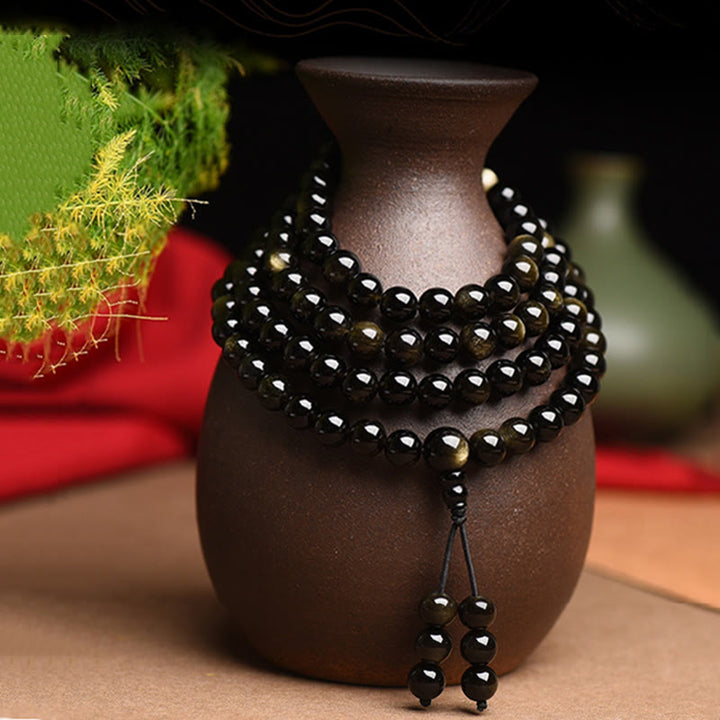 Braccialetto della ricchezza in ossidiana naturale con 108 perle di Mala Buddha Stones