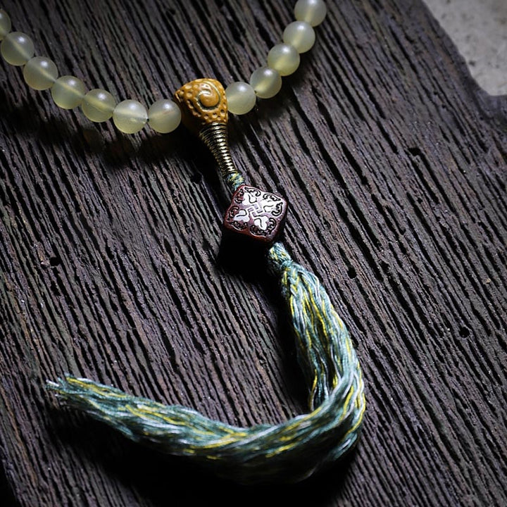 Braccialetto della fortuna in ambra e corno di pecora del Tibet con 108 perle di Mala Buddha Stones