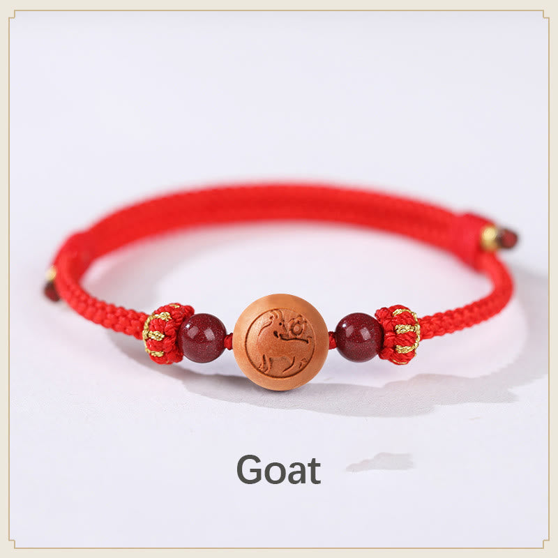 Braccialetto della ricchezza in cinabro intagliato con carattere dello zodiaco cinese Fu in legno di pesca naturale Buddha Stones