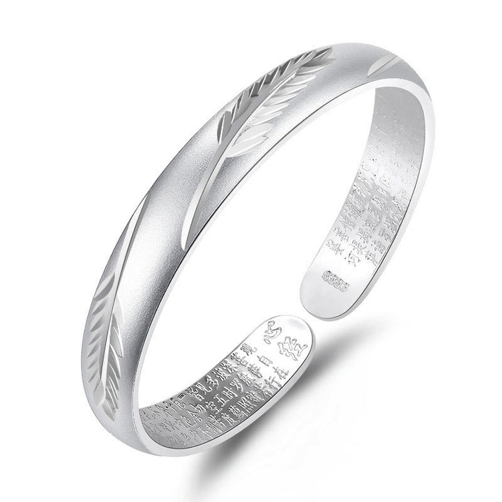 Bracciale rigido in rame con motivo inciso a forma di cuore con piume Buddha Stones, modello Wealth