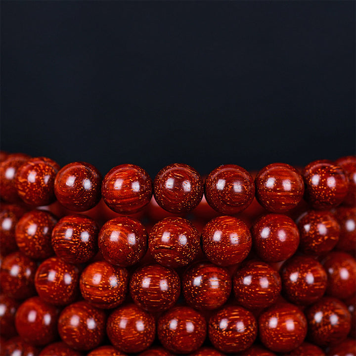 Braccialetto di equilibrio in legno di sandalo rosso con foglia piccola tibetana Buddha Stones