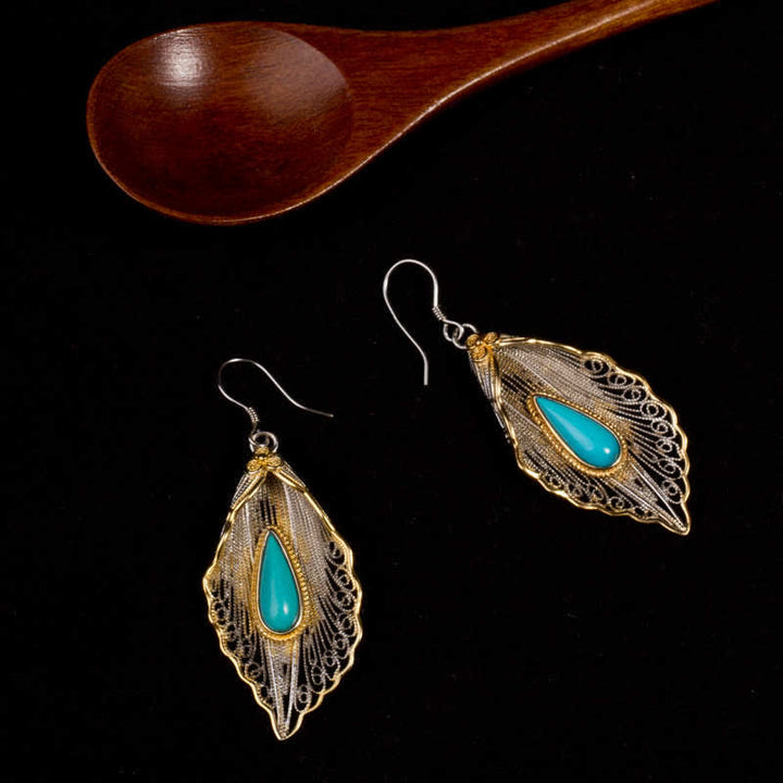 Orecchini pendenti con motivo a foglia di Bodhi in argento sterling 925 con Buddha Stones e turchese