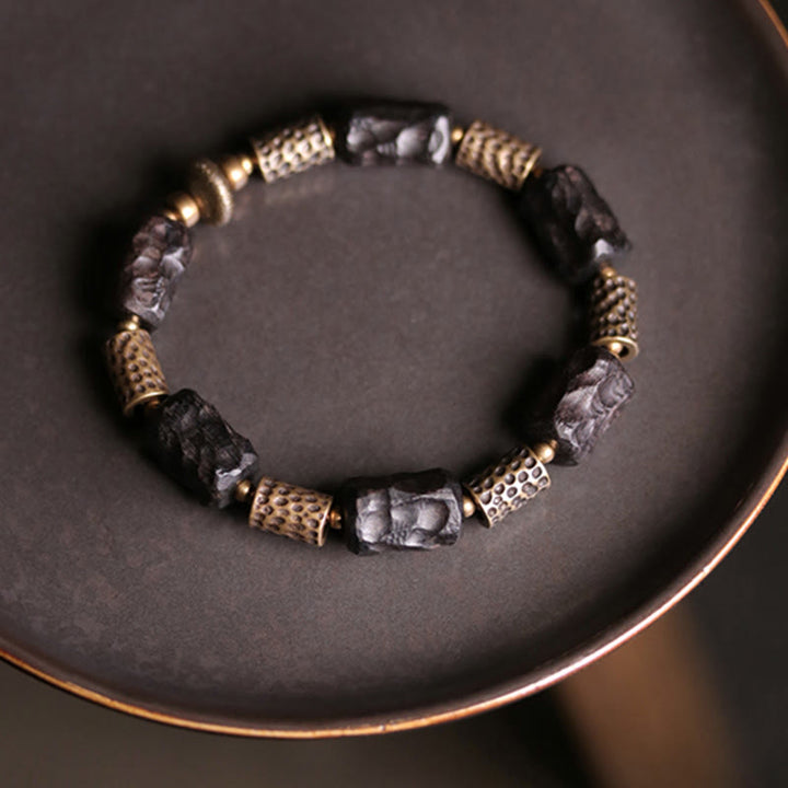 Braccialetto Buddha Stones Tibetano Ebano Legno Rame Calma Pace