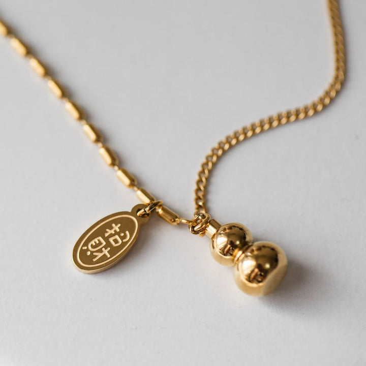 Cavigliera con fibbia della ricchezza e design a zucca portafortuna in oro 18k Buddha Stones