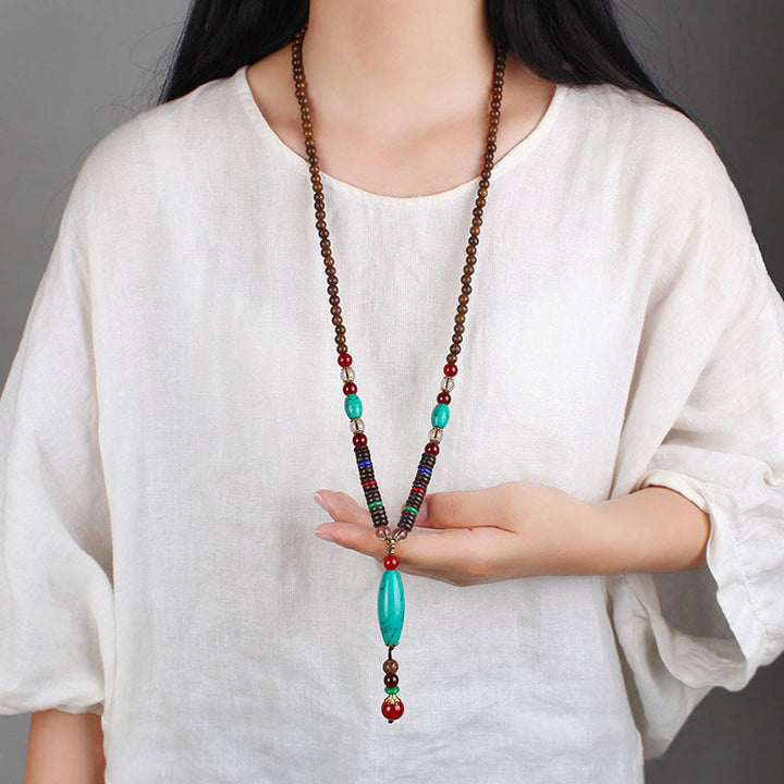 Collana con ciondolo in pietra turchese, pietra di legno di wenge, protezione e calma Buddha Stones