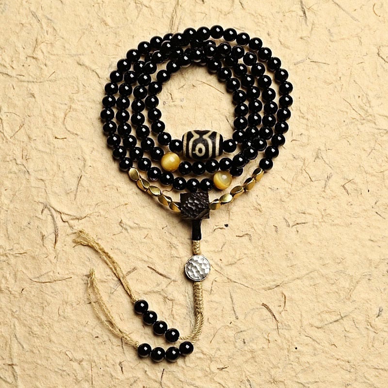 Buddha Stones Tibetano 108 Mala Beads Onice Nero Tre Occhi Dzi Beads Bracciale di Protezione