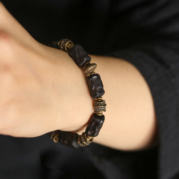Braccialetto Buddha Stones Tibetano Ebano Legno Rame Calma Pace