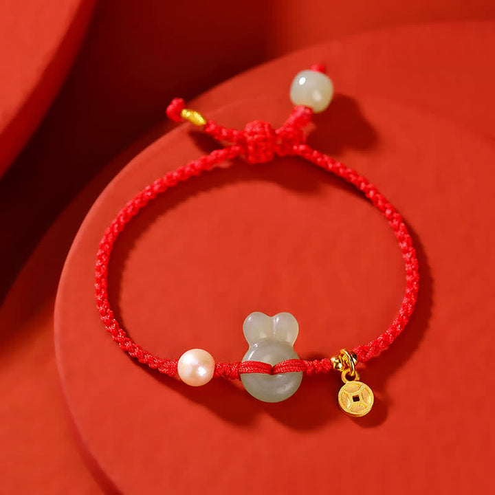 Braccialetto in corda rossa con moneta di rame e giada di Hetian dell'anno del coniglio in argento sterling 925