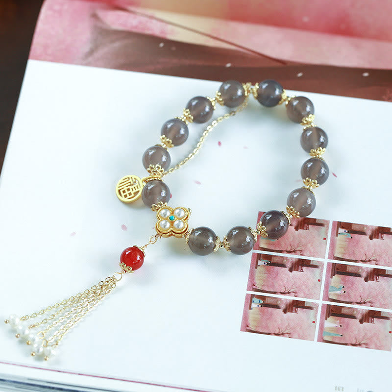 Braccialetto di equilibrio con nappa di perle di carattere Fu in agata grigia naturale Buddha Stones