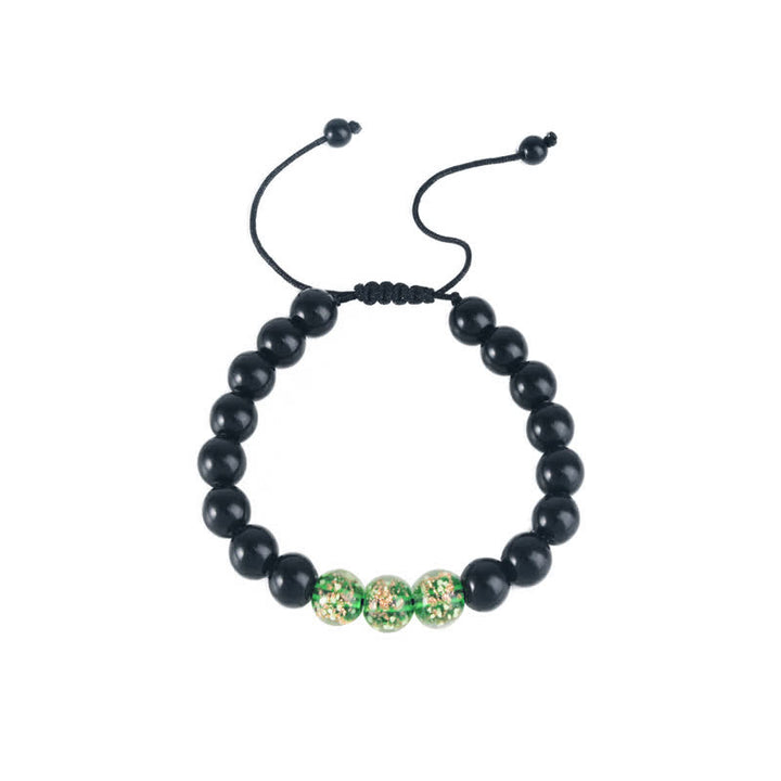 Braccialetto di forza in pietra luminosa con ossidiana nera Buddha Stones