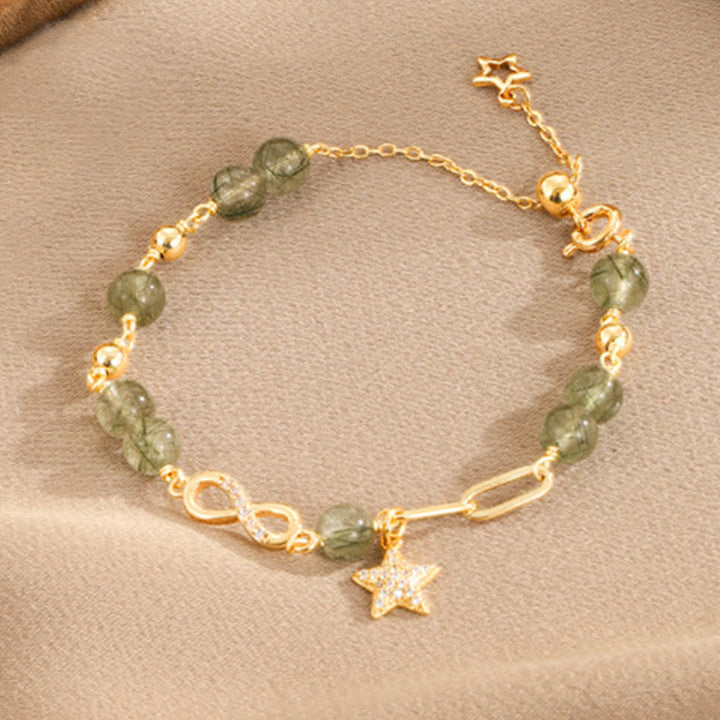 Bracciale Buddha Stones in oro 14K con quarzo rutilato verde e anello Möbius, protezione della stella dell'amore eterno