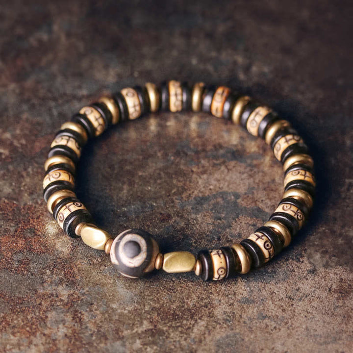 Braccialetto di forza in perline di osso tibetano e legno di ebano con Buddha Stones
