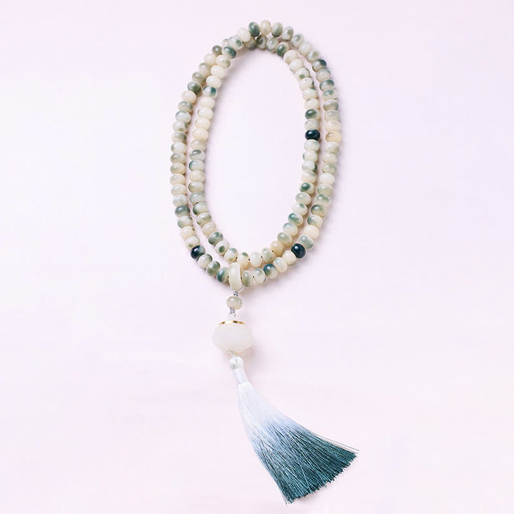 Buddha Stones naturali 108 perle Mala Bodhi Seed Lotus inciso braccialetto di saggezza nappa