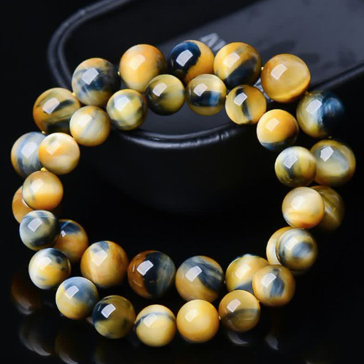 Braccialetto di protezione e forza con occhio di tigre Buddha Stones