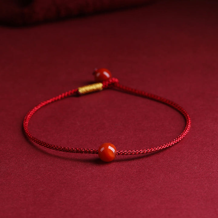 Braccialetto di corda rossa con benedizione in agata rossa naturale e cinabro Buddha Stones