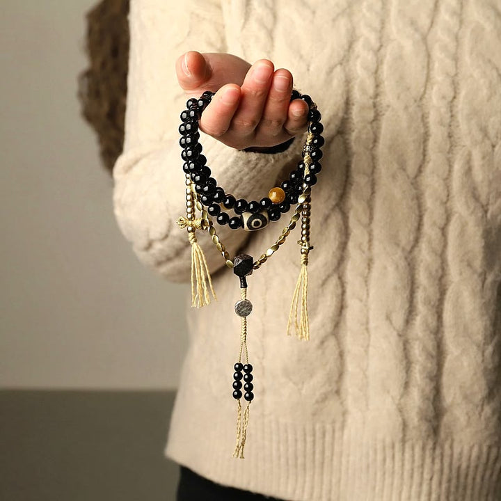 Buddha Stones Tibetano 108 Mala Beads Onice Nero Tre Occhi Dzi Beads Bracciale di Protezione