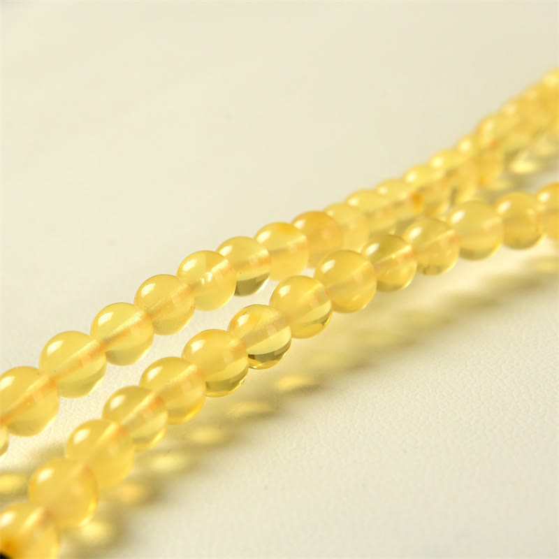 Braccialetto anti-ansia con 108 perline di mala in ambra naturale e trasparente Buddha Stones