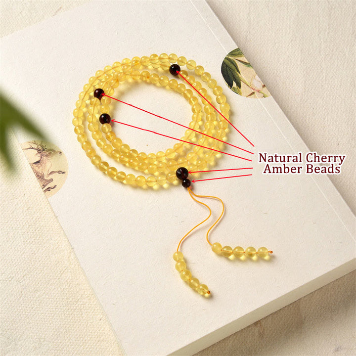 Braccialetto anti-ansia con 108 perline di mala in ambra naturale e trasparente Buddha Stones