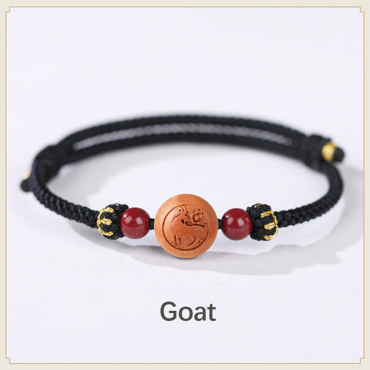 Braccialetto della ricchezza in cinabro intagliato con carattere dello zodiaco cinese Fu in legno di pesca naturale Buddha Stones
