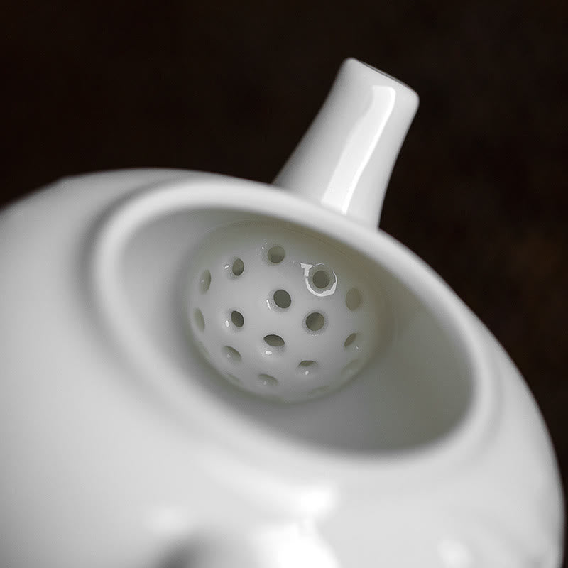 Teiera in ceramica con motivo inciso in bambù e pino prugna bianca