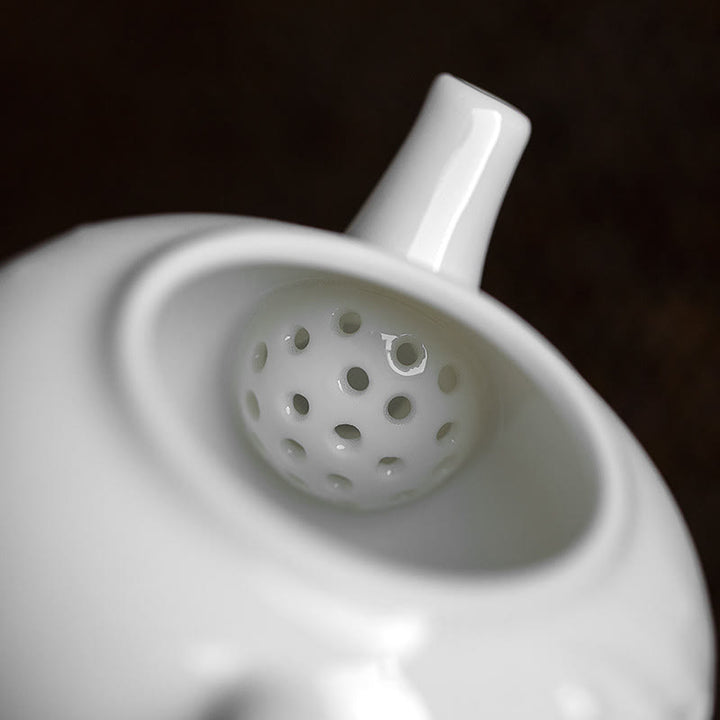 Teiera in ceramica con motivo inciso in bambù e pino prugna bianca