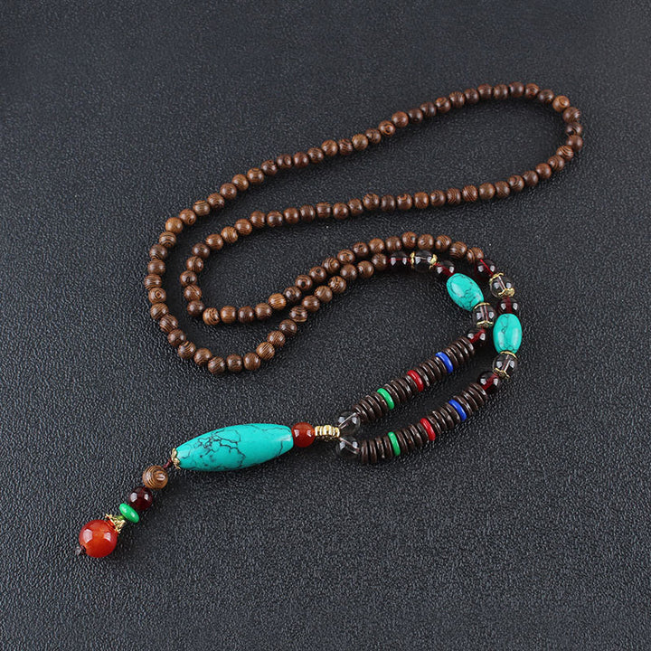 Collana con ciondolo in pietra turchese, pietra di legno di wenge, protezione e calma Buddha Stones