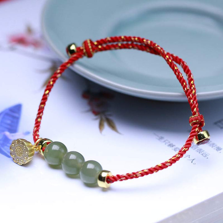 Braccialetto intrecciato con corda rossa in semi di loto di giada naturale Buddha Stones