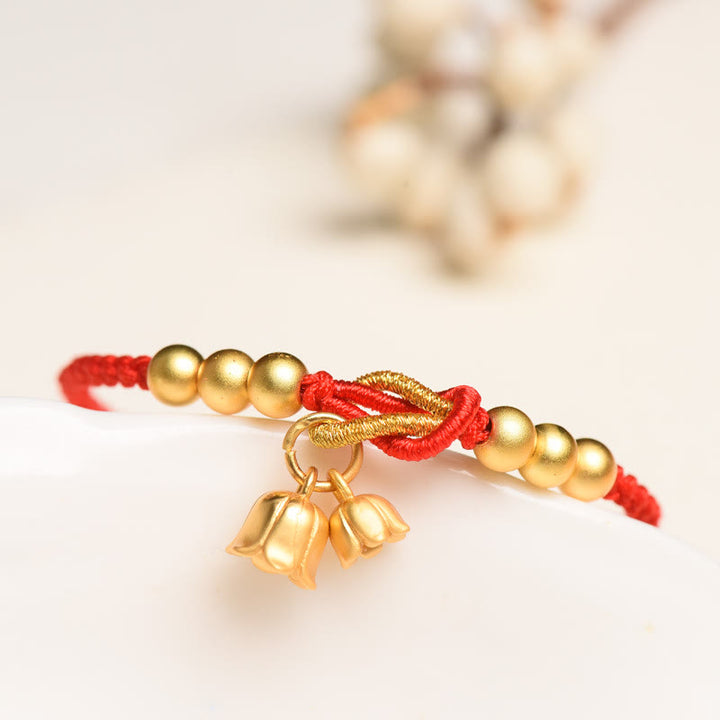 Bracciale intrecciato con ciondolo a forma di fiore di mughetto fatto a mano con Buddha Stones e protezione dalla fortuna