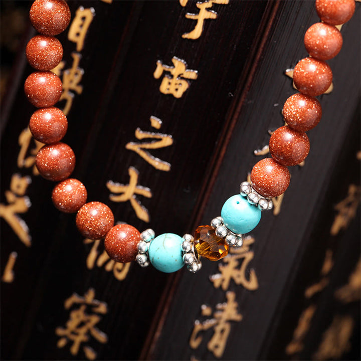 Buddha Stones 108 Mala Beads Goldstone Om Mani Padme Hum Swastika Braccialetto di Fiducia
