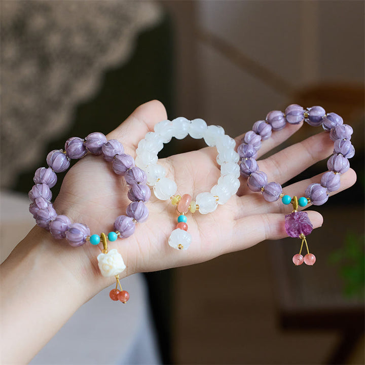 Braccialetto dell'illuminazione con ciondolo leone danzante avorio, perline di vetro Liuli, motivo loto, fluorite e Buddha Stones