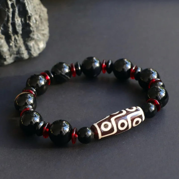 Braccialetto di protezione della ricchezza con perline Dzi a nove occhi in onice nero Buddha Stones