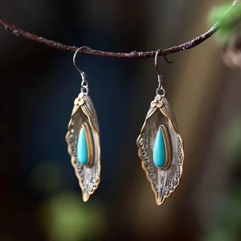 Orecchini pendenti con motivo a foglia di Bodhi in argento sterling 925 con Buddha Stones e turchese