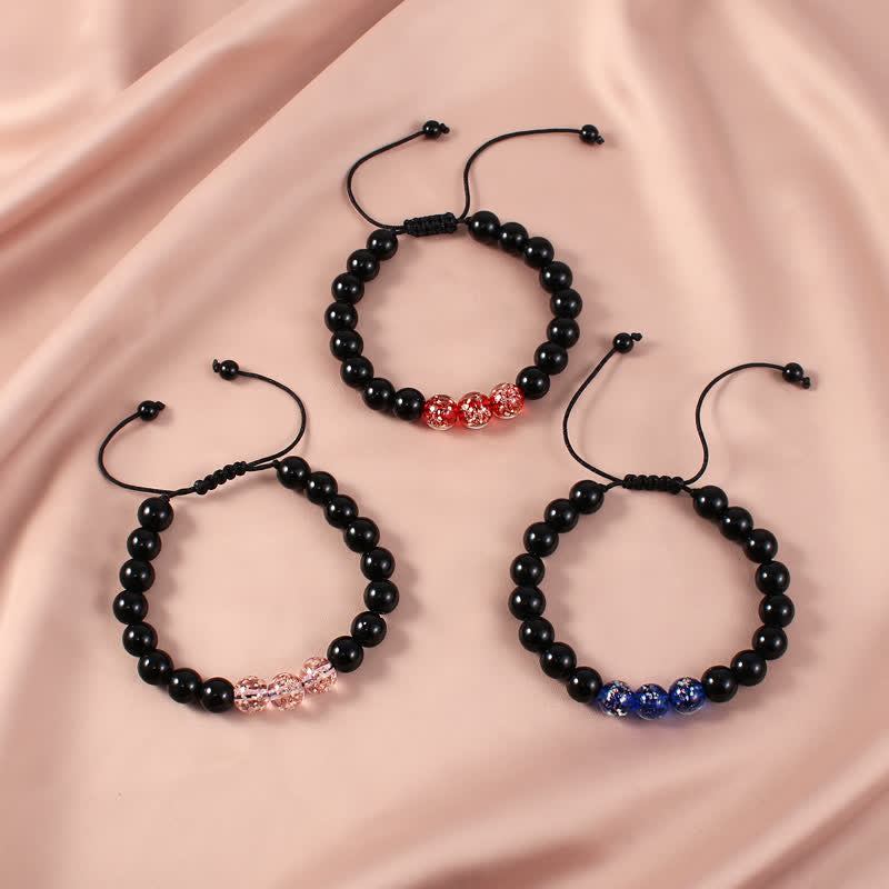 Braccialetto di forza in pietra luminosa con ossidiana nera Buddha Stones