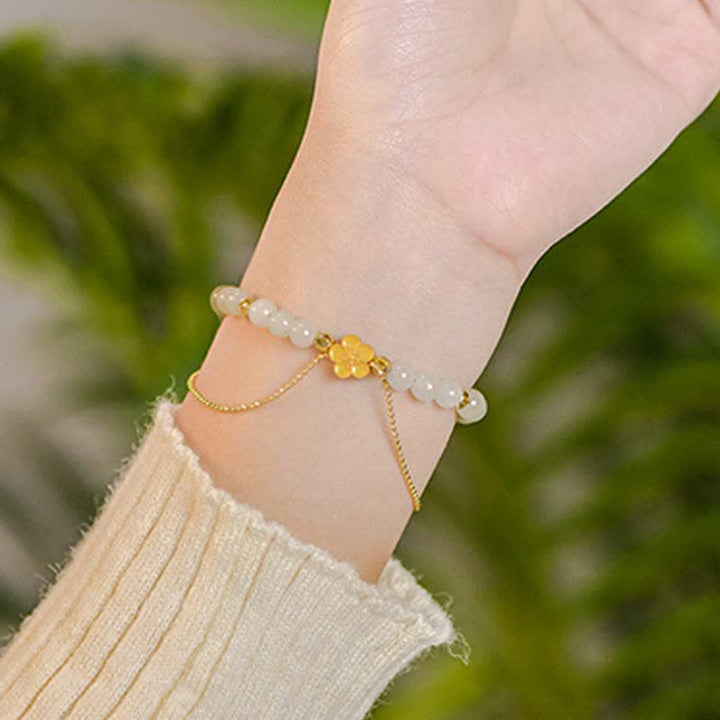 Bracciale Buddha Stones in argento sterling 925 con giada naturale Hetian e fiori di pesco